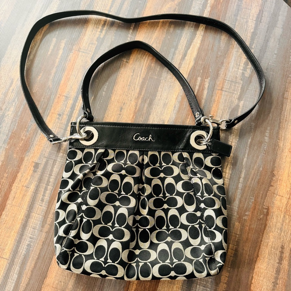 Coach crossbody, black and gray with silver hardware with straps.